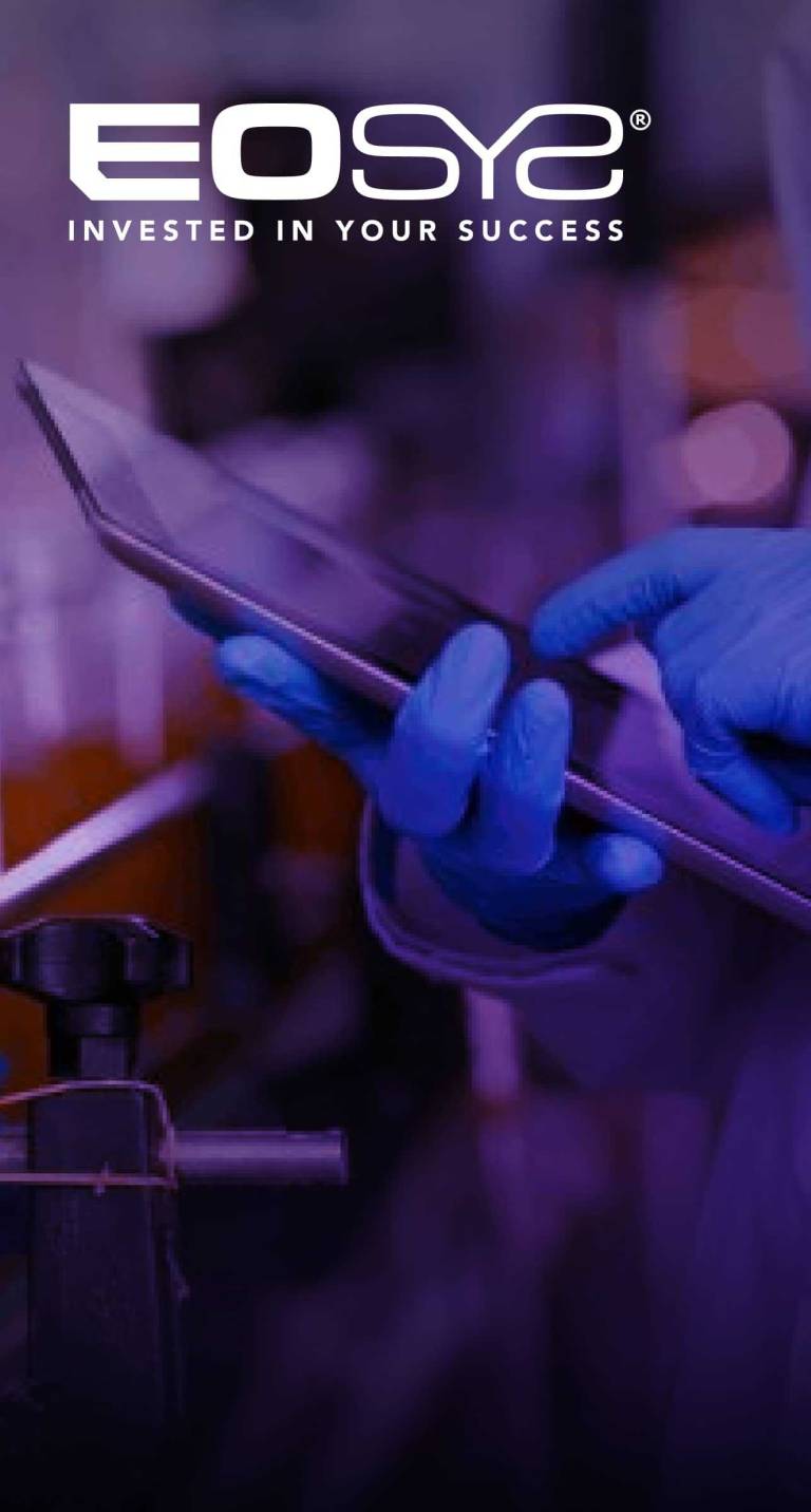 Hands with latex gloves using a tablet