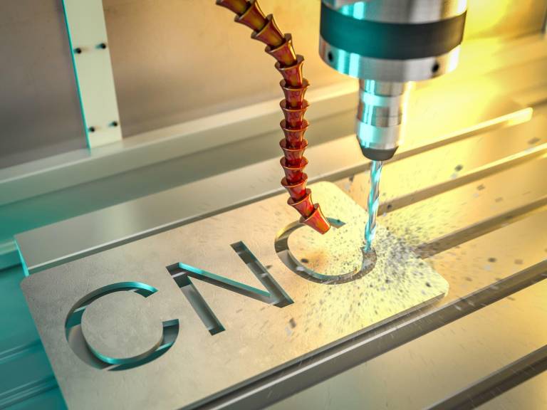 Cnc-machine cutting the letters cnc in an aluminum plate