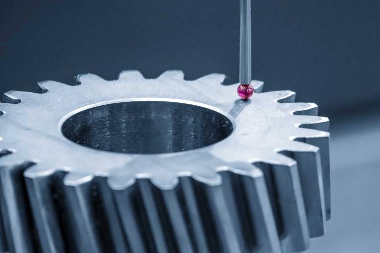 CMM machine checking the dimensions of a part for quality control of mechanical parts with multi axis CMM machine