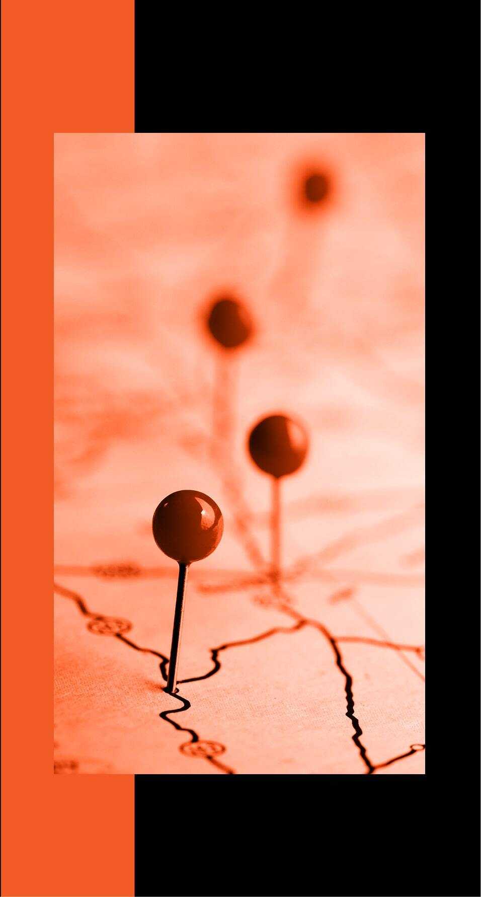 A map with four pins stuck in it with an orange filter and black and orange background