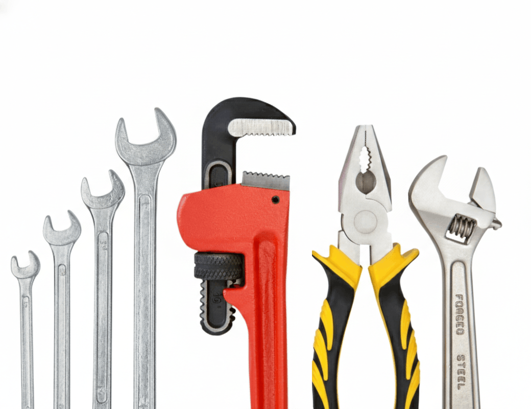 a row of basic hand tools lined up on a white background showing the difference between general purpose tools and specialized expertise for manufacturers choosing a web agency