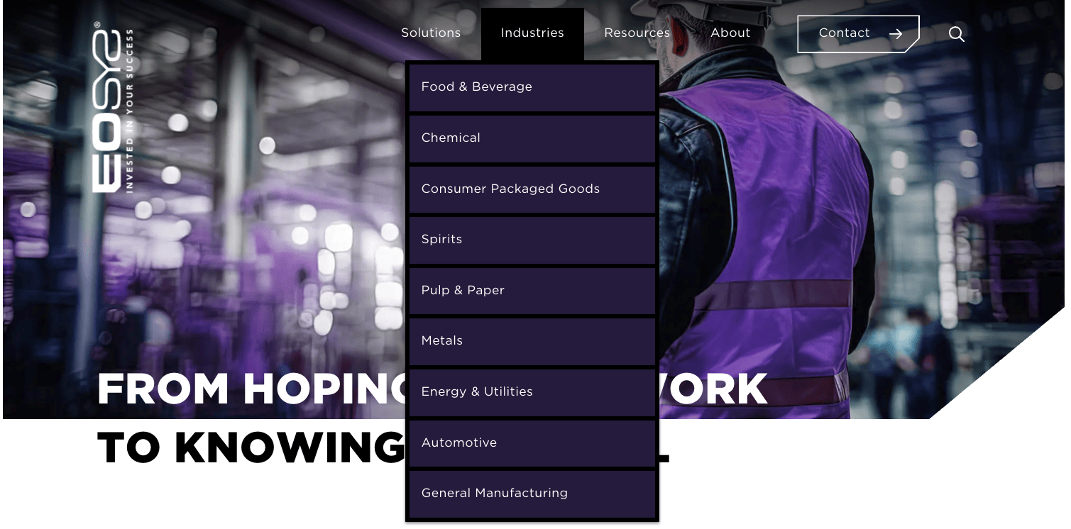 industrial worker in safety gear holding a tablet in a manufacturing environment beside the headline “From Hoping Things Work to Knowing They Will,” with the EOS logo visible