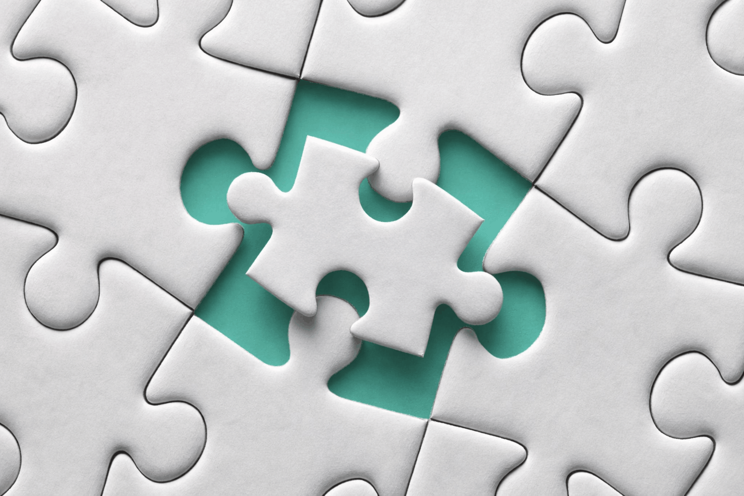 puzzle with a mismatched single piece being placed into a contrasting slot, illustrating how one‑size‑fits‑all marketing rarely fits the complexity of modern manufacturing buyers.