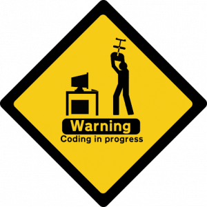 Yellow diamond graphic stating Warning Coding in Progress