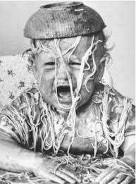Picture of a baby with a bowl of spaghetti on his head to illustrate spaghetti code