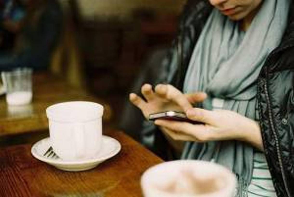 image of texting over coffee